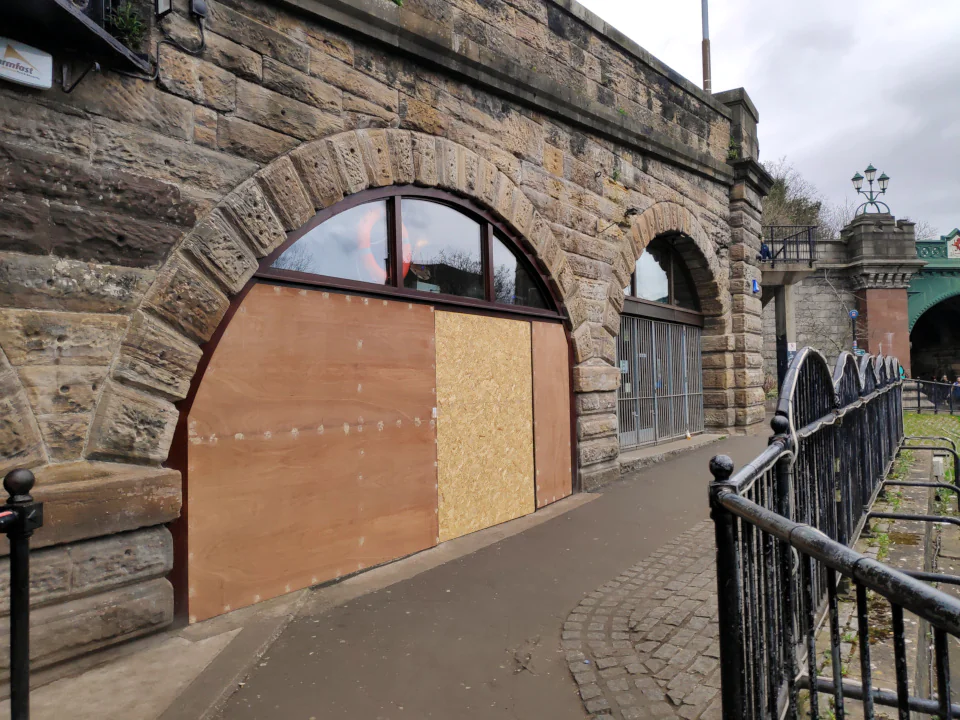 Another boarded up bar.