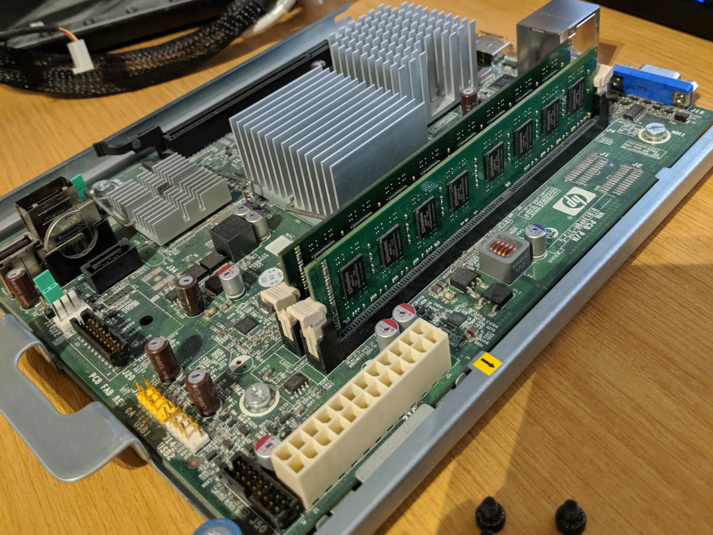 Pulling the motherboard, it's not in bad shape at all.